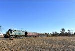 The 2003 approaches the Point Airy Road Grade Crossing with its train